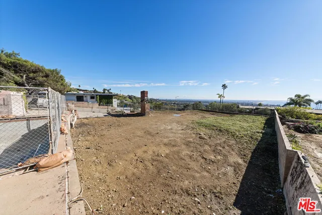 a view of a yard with an ocean view