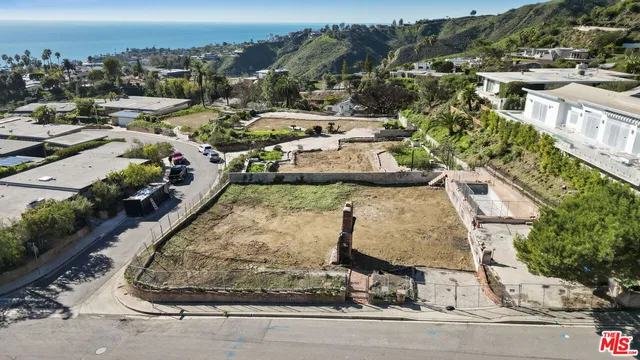 aerial view of a house with outdoor space