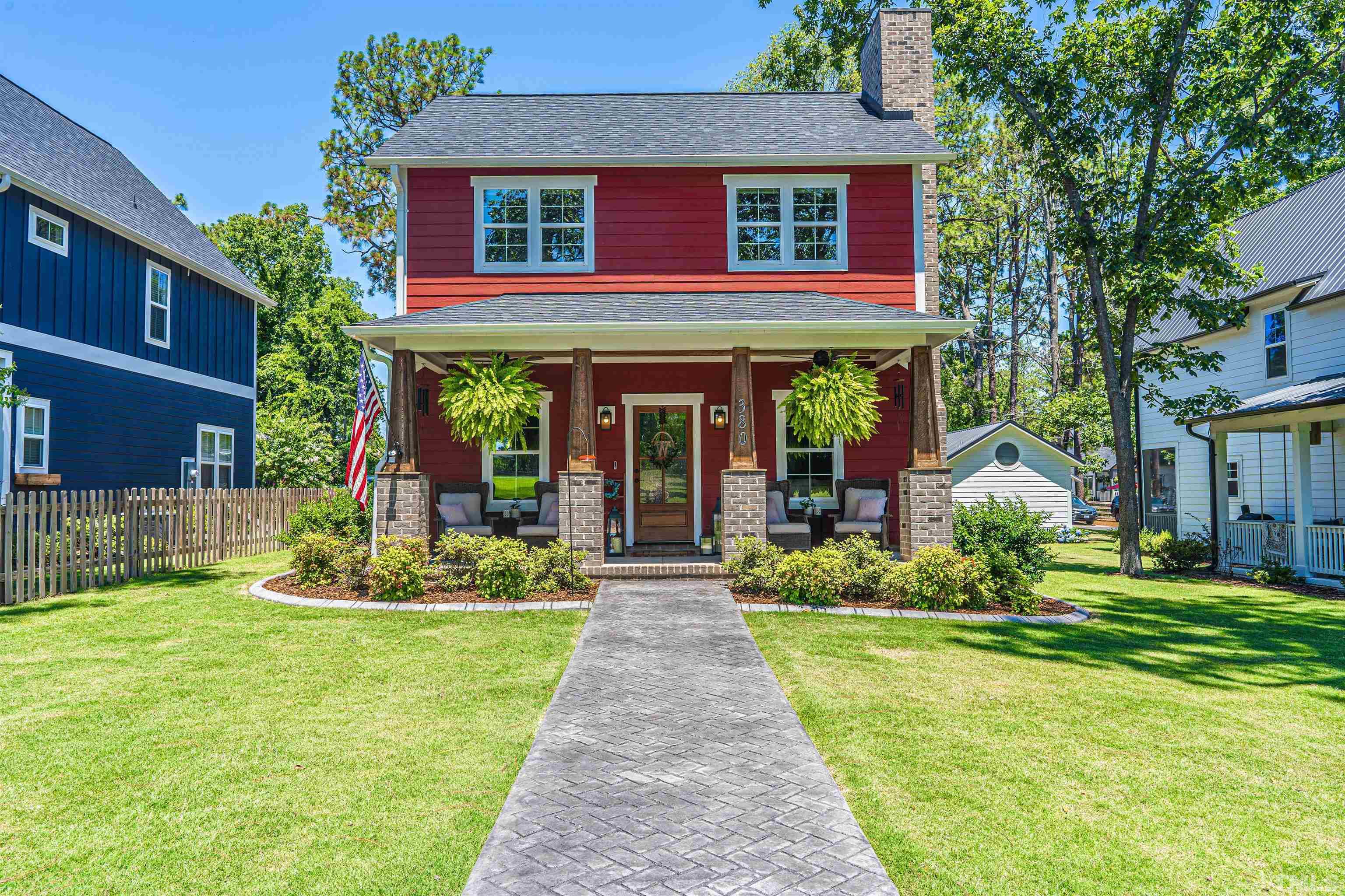 380 Sheldon Road Southern Pines, NC 28387 - Photo 1 of 32 a front view of a house with garden and porch
