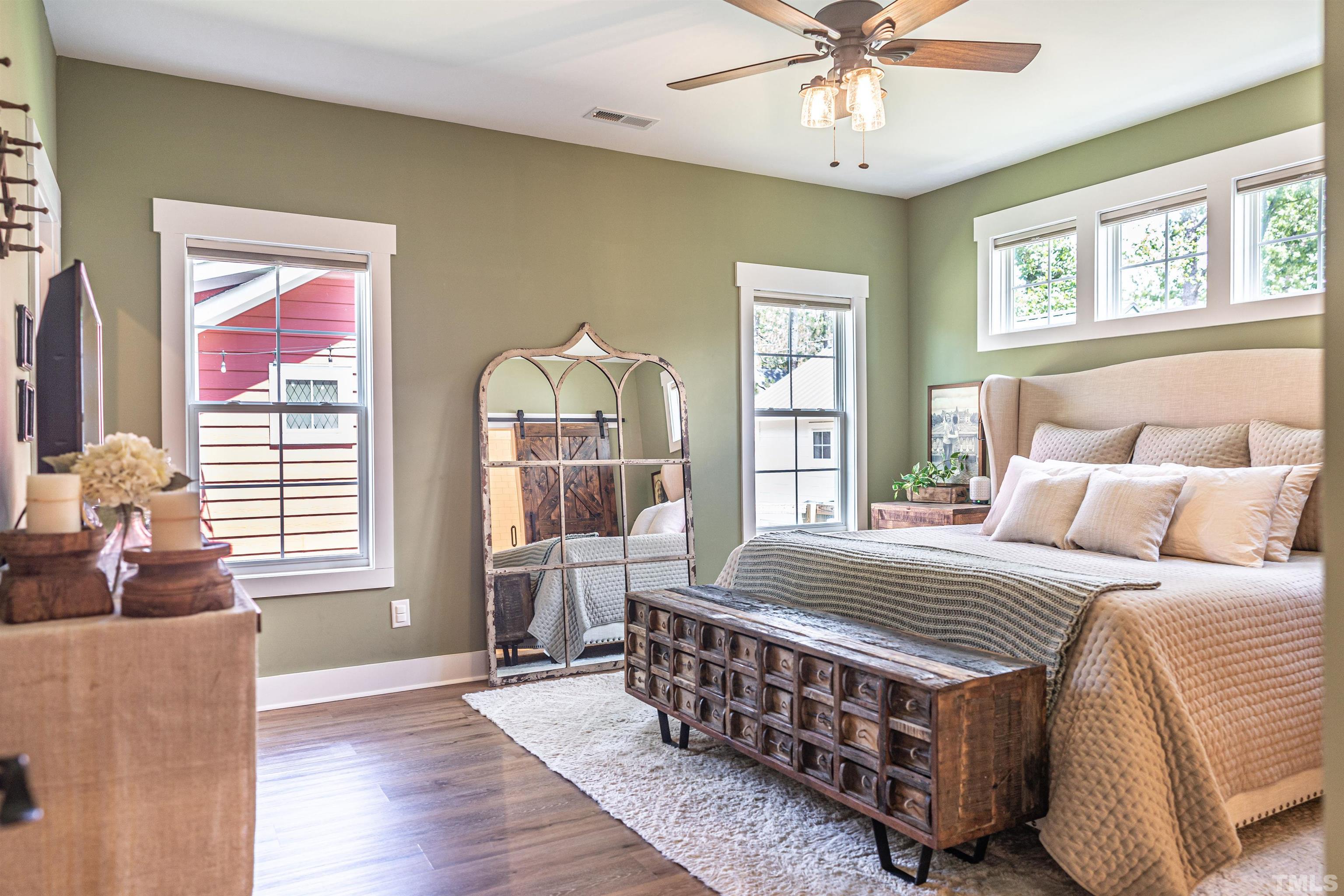 380 Sheldon Road Southern Pines, NC 28387 - Photo 13 of 32 a bedroom with a bed wooden floor and window