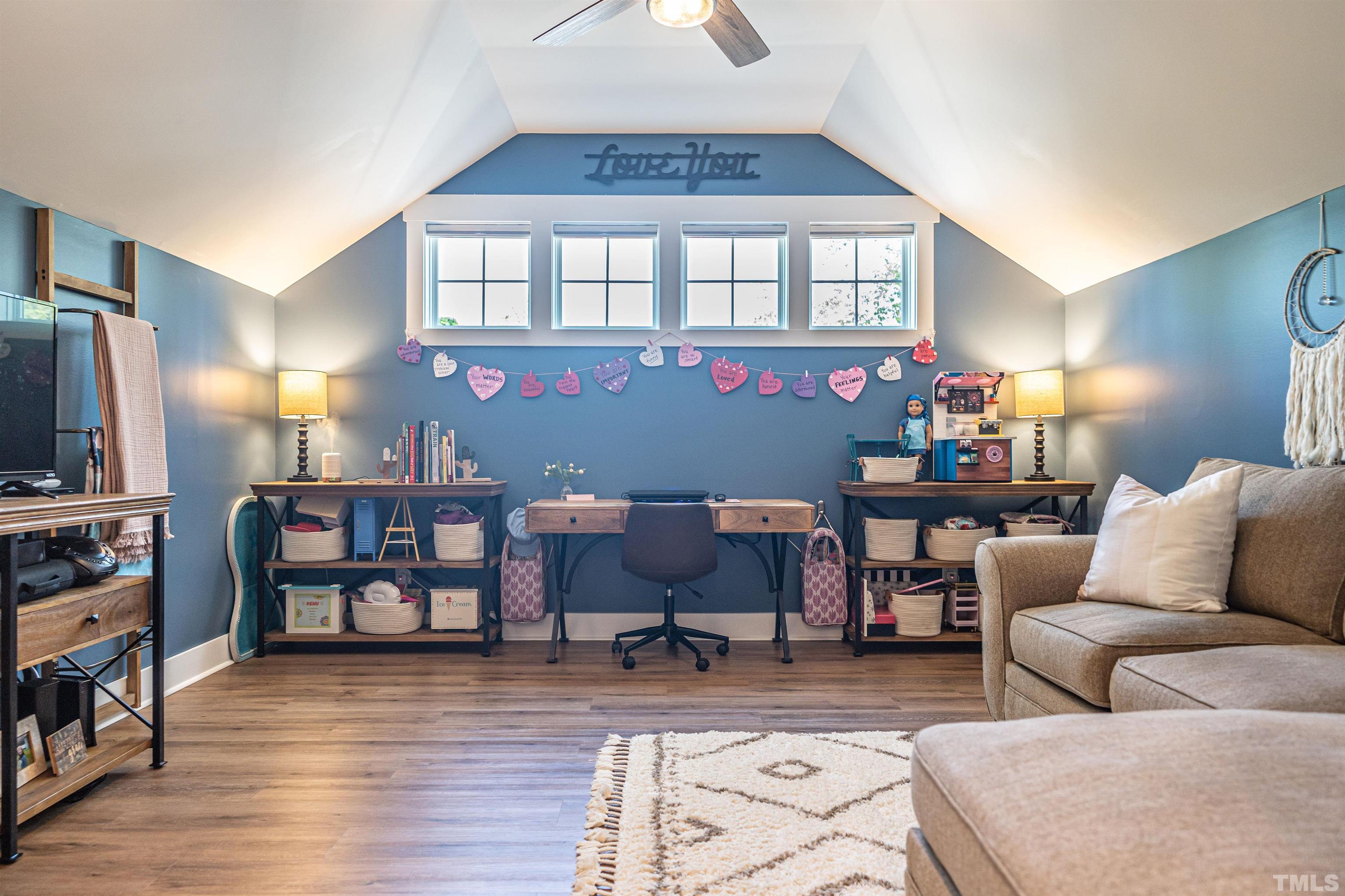 380 Sheldon Road Southern Pines, NC 28387 - Photo 19 of 32 a living room with furniture a rug and a flat screen tv