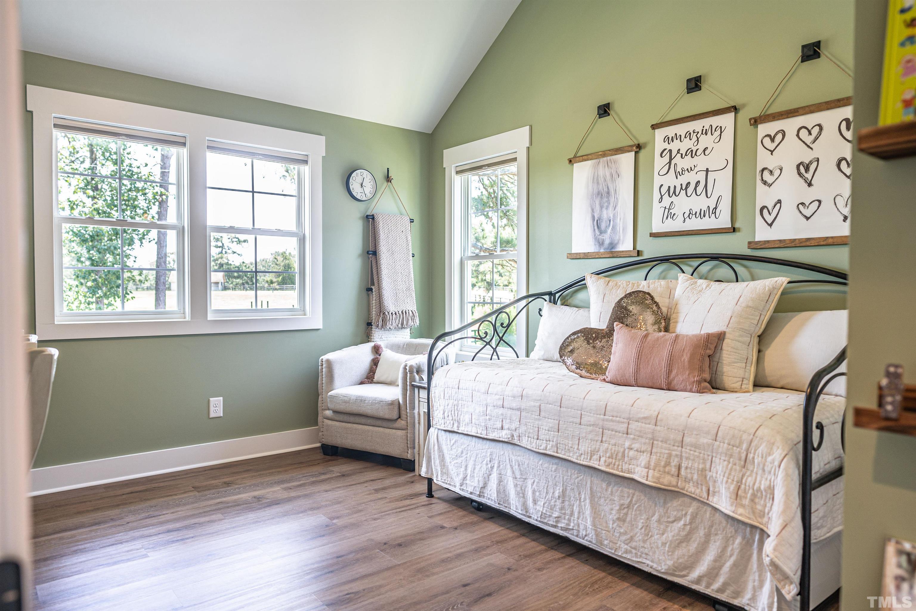 380 Sheldon Road Southern Pines, NC 28387 - Photo 21 of 32 a bedroom with a bed and a large window