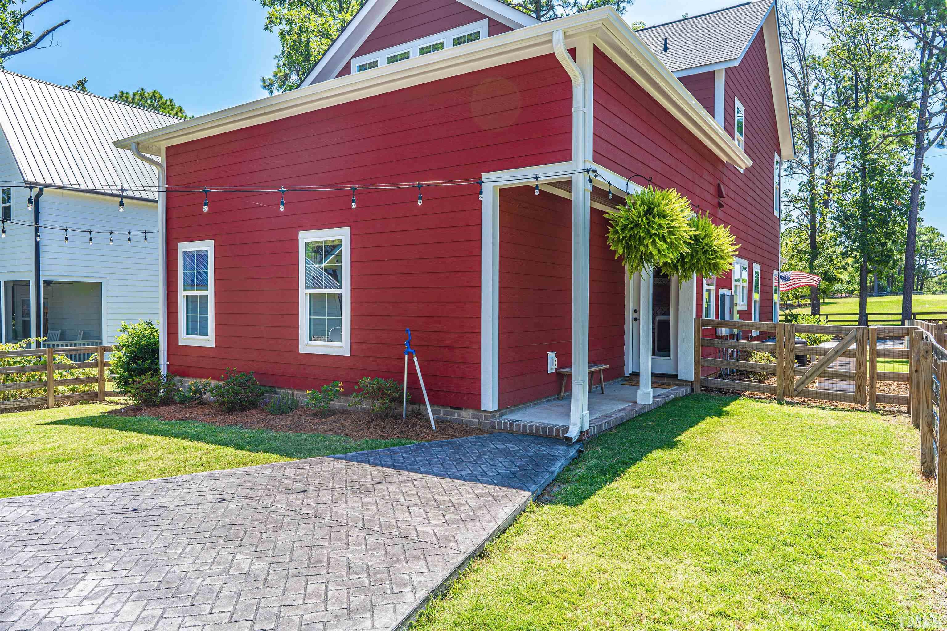 380 Sheldon Road Southern Pines, NC 28387 - Photo 27 of 32 a view of a house with backyard porch and sitting area