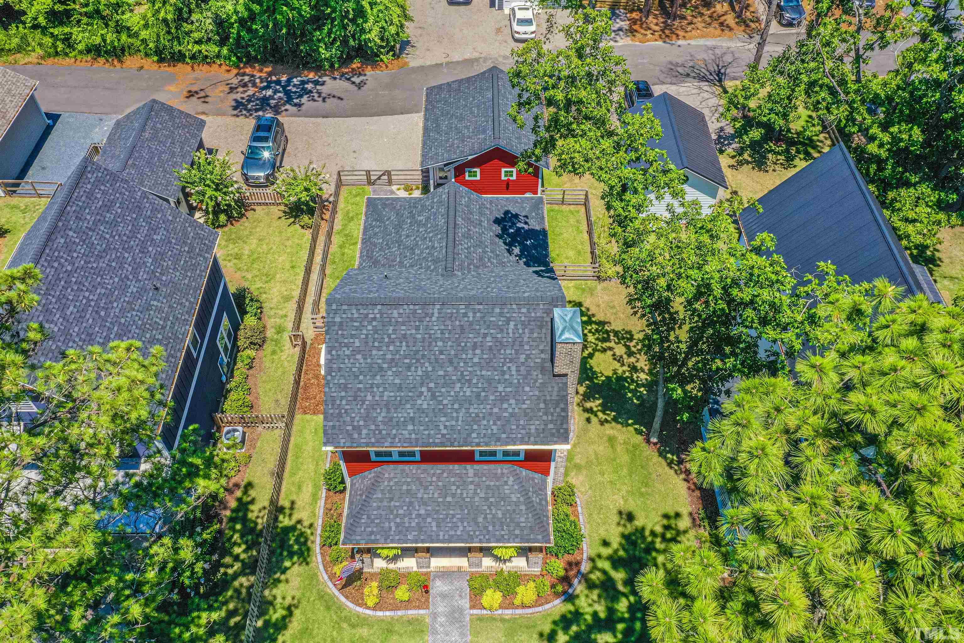 380 Sheldon Road Southern Pines, NC 28387 - Photo 30 of 32 an aerial view of a house with swimming pool and large trees