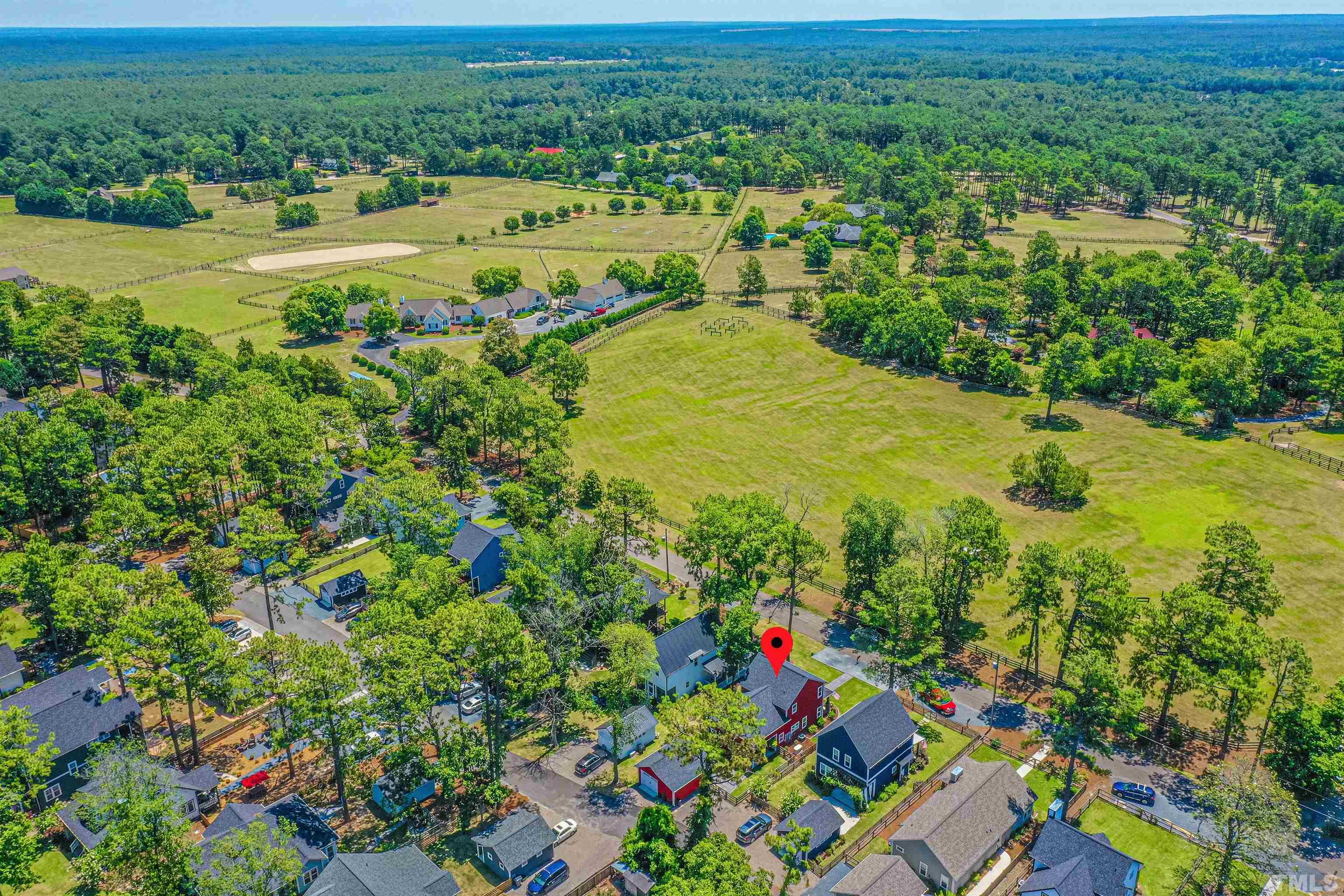 380 Sheldon Road Southern Pines, NC 28387 - Photo 31 of 32 an aerial view of residential houses with outdoor space and trees