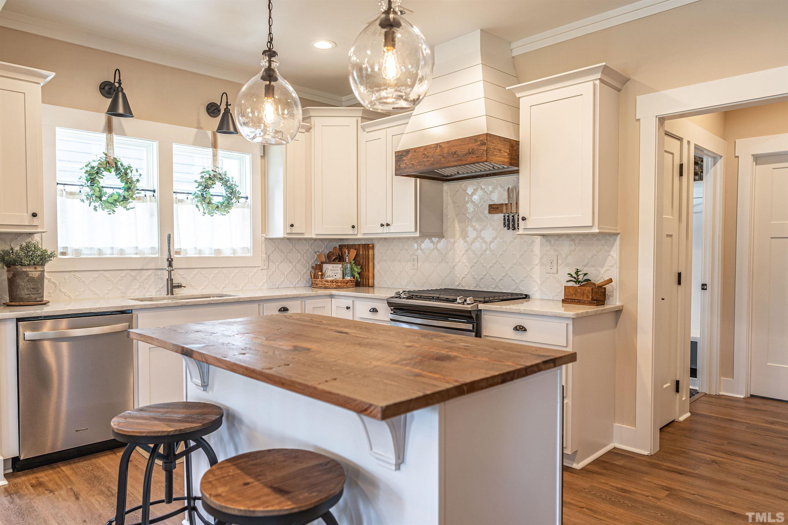 380 Sheldon Road Southern Pines, NC 28387 - Photo 7 of 32 a kitchen with a sink a stove and a refrigerator
