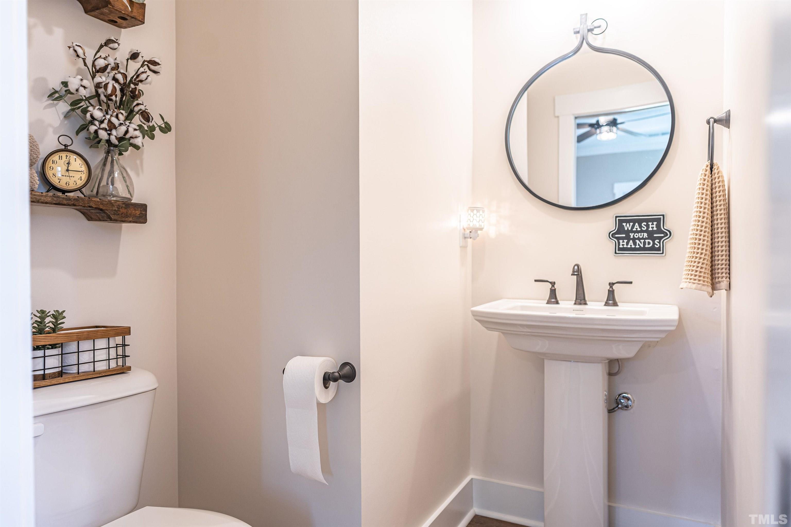 380 Sheldon Road Southern Pines, NC 28387 - Photo 10 of 32 a bathroom with a sink mirror and toilet