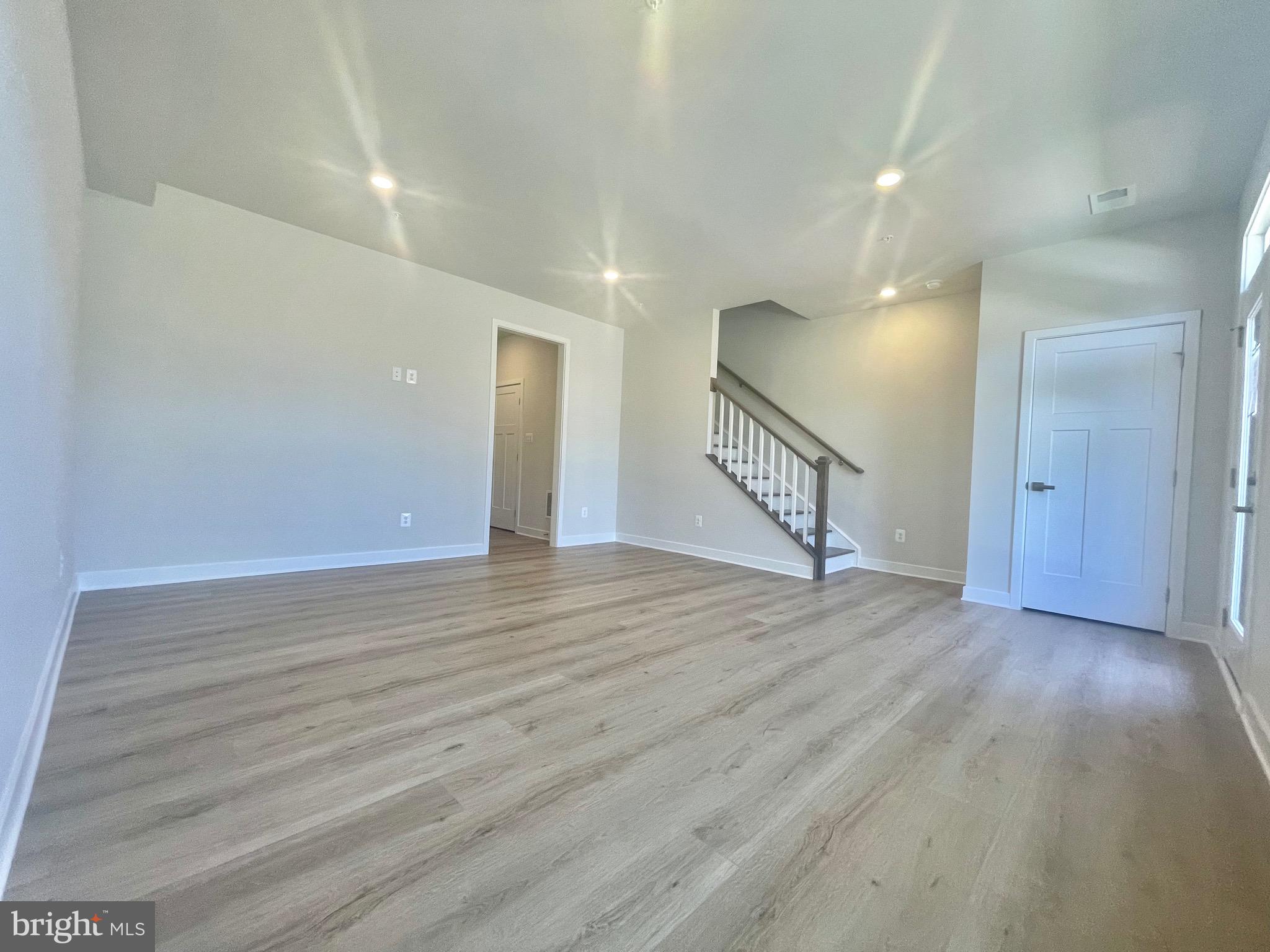 3563 Worthington Boulevard Frederick, MD 21704 - Photo 3 of 52 a view of an empty room with wooden floor and stairs