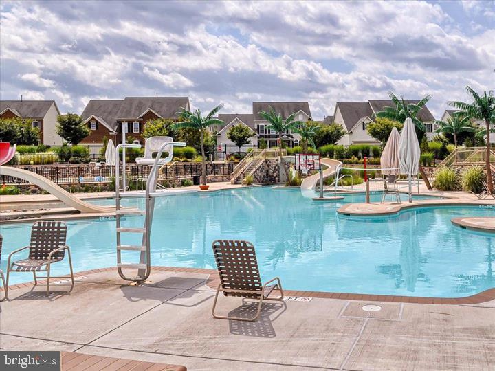 3563 Worthington Boulevard Frederick, MD 21704 - Photo 36 of 52 a view of a swimming pool with lawn chairs