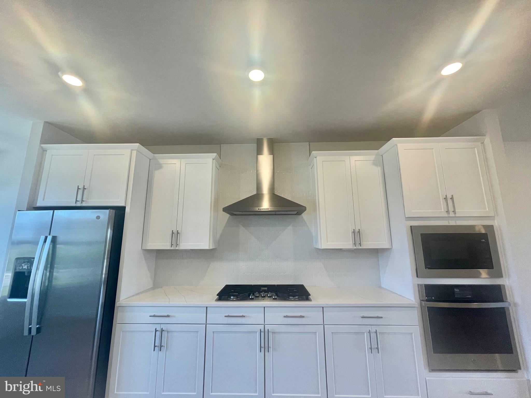 3563 Worthington Boulevard Frederick, MD 21704 - Photo 7 of 52 a kitchen with stainless steel appliances granite countertop a refrigerator a stove and a sink