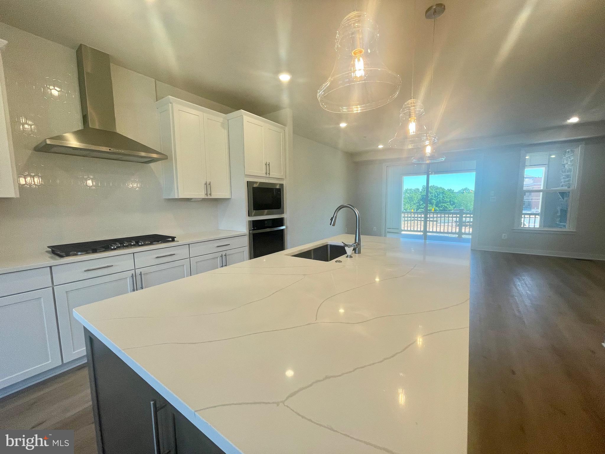 3563 Worthington Boulevard Frederick, MD 21704 - Photo 9 of 52 a kitchen with kitchen island a sink stainless steel appliances and cabinets