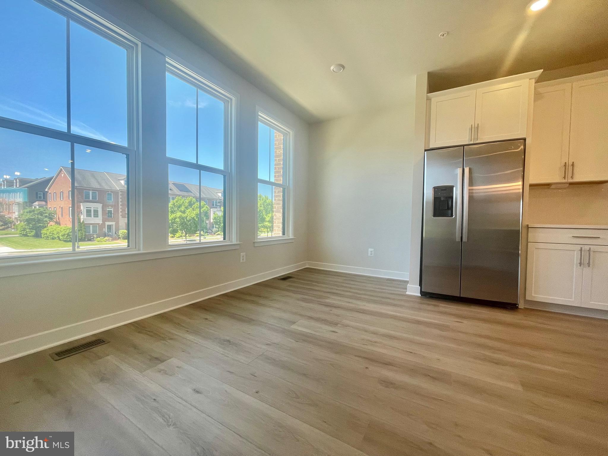 3563 Worthington Boulevard Frederick, MD 21704 - Photo 10 of 52 a view of an empty room with wooden floor and a window