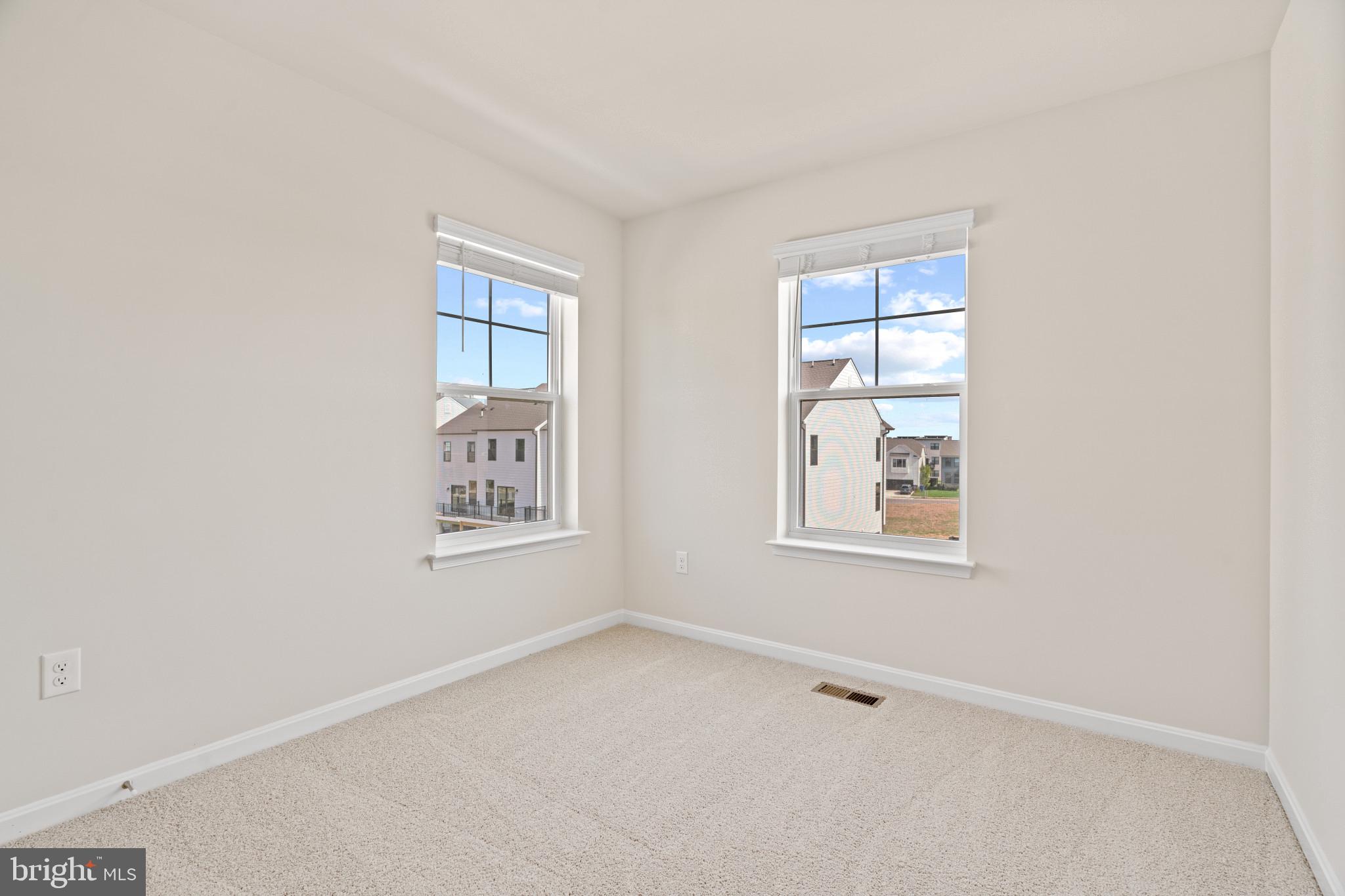 725 Compass Way Frederick, MD 21701 - Photo 17 of 47 an empty room with windows