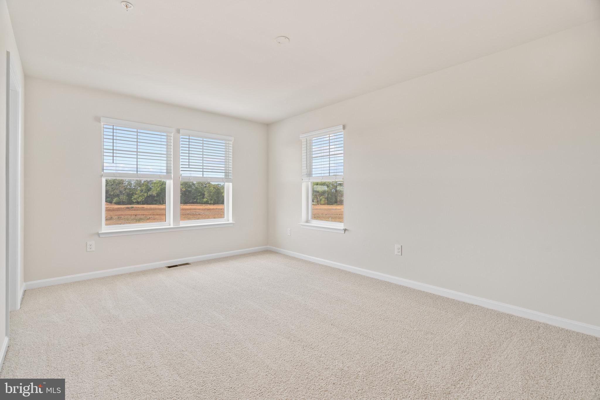 725 Compass Way Frederick, MD 21701 - Photo 19 of 47 an empty room with windows