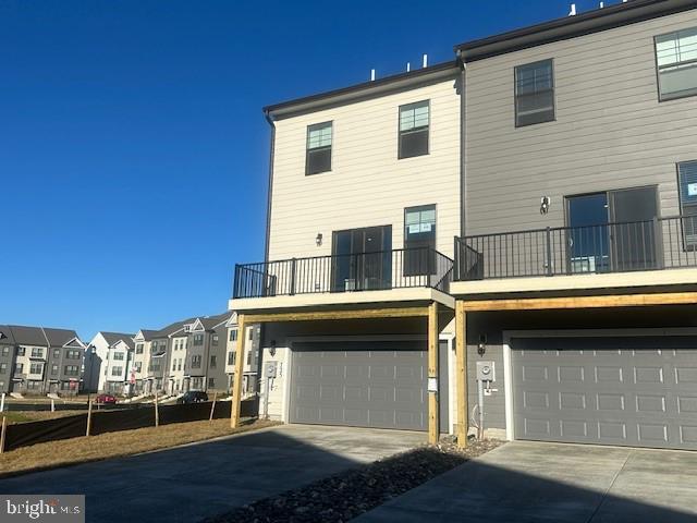 725 Compass Way Frederick, MD 21701 - Photo 3 of 47 a front view of a house with a yard
