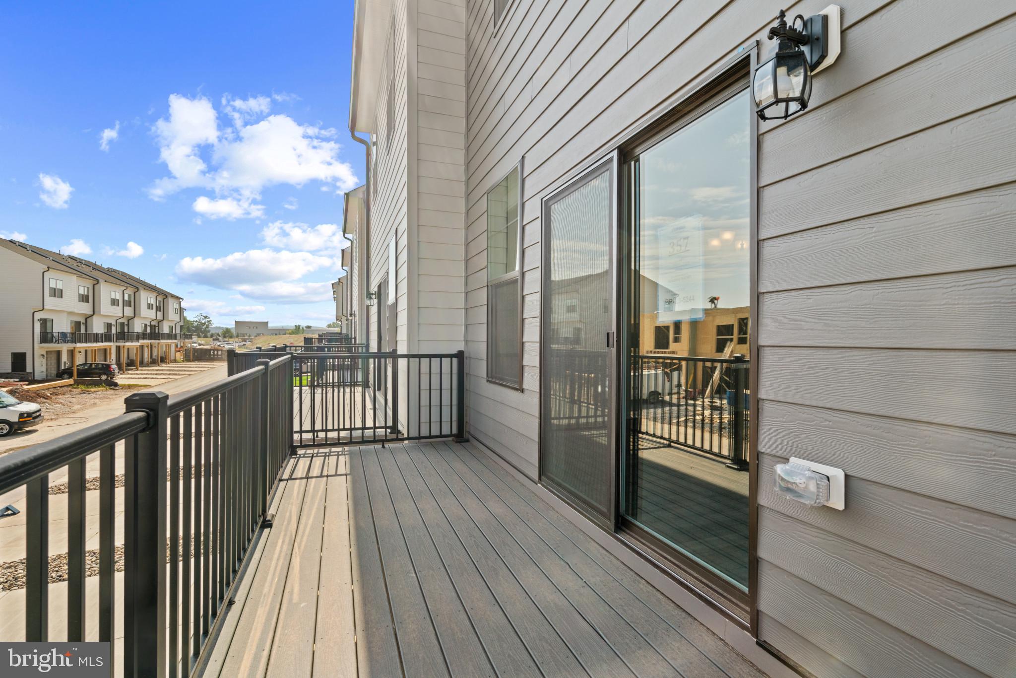 725 Compass Way Frederick, MD 21701 - Photo 33 of 47 a view of a balcony with wooden floor and fence