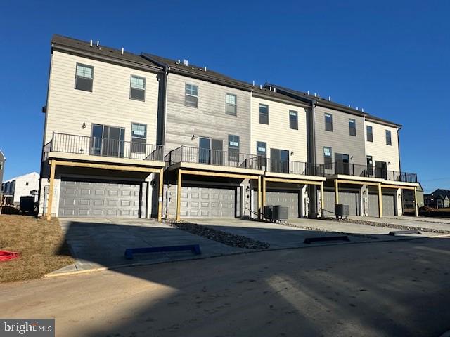 725 Compass Way Frederick, MD 21701 - Photo 4 of 47 a front view of a house with a yard