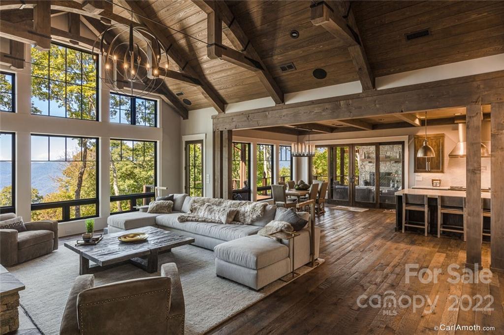 61 Back Bone Way, Unit 203 Sylva, NC 28779 - Photo 11 of 48 a living room with furniture and large windows