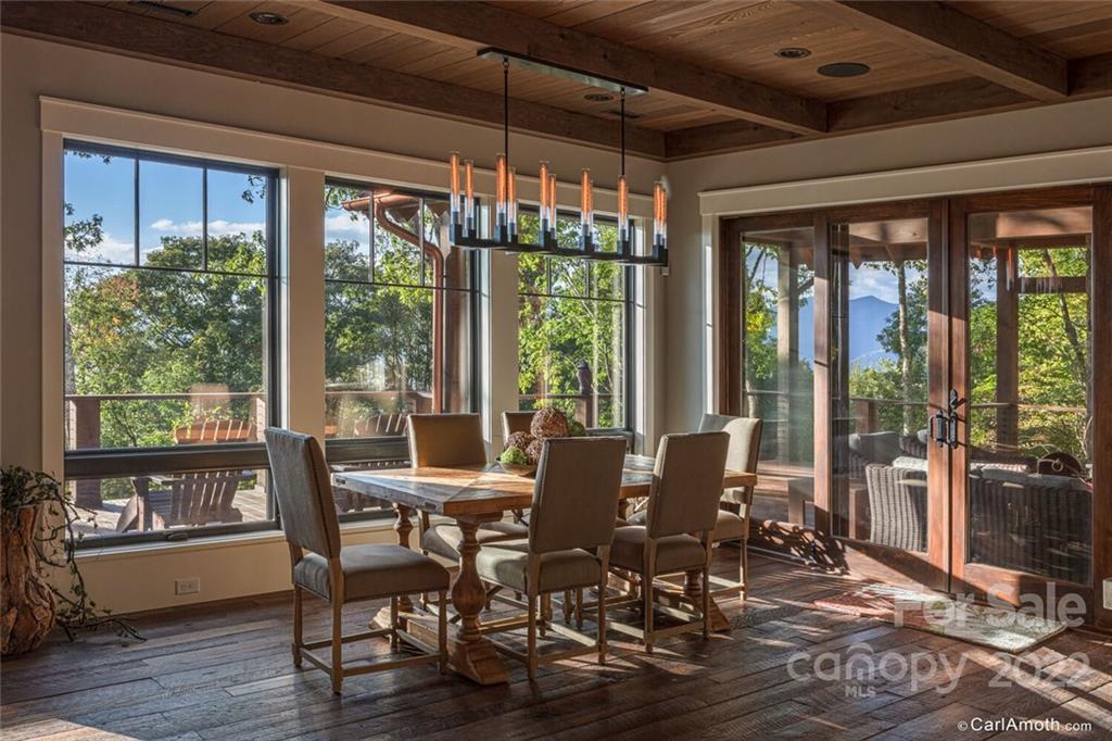 61 Back Bone Way, Unit 203 Sylva, NC 28779 - Photo 14 of 48 a view of a dining room with furniture window and outside view