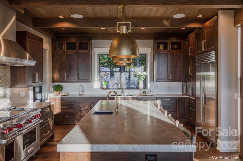 61 Back Bone Way, Unit 203 Sylva, NC 28779 - Photo 16 of 48 a kitchen with a stove a sink and a refrigerator