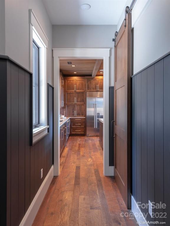 61 Back Bone Way, Unit 203 Sylva, NC 28779 - Photo 20 of 48 a view of a hallway with wooden floor and closet