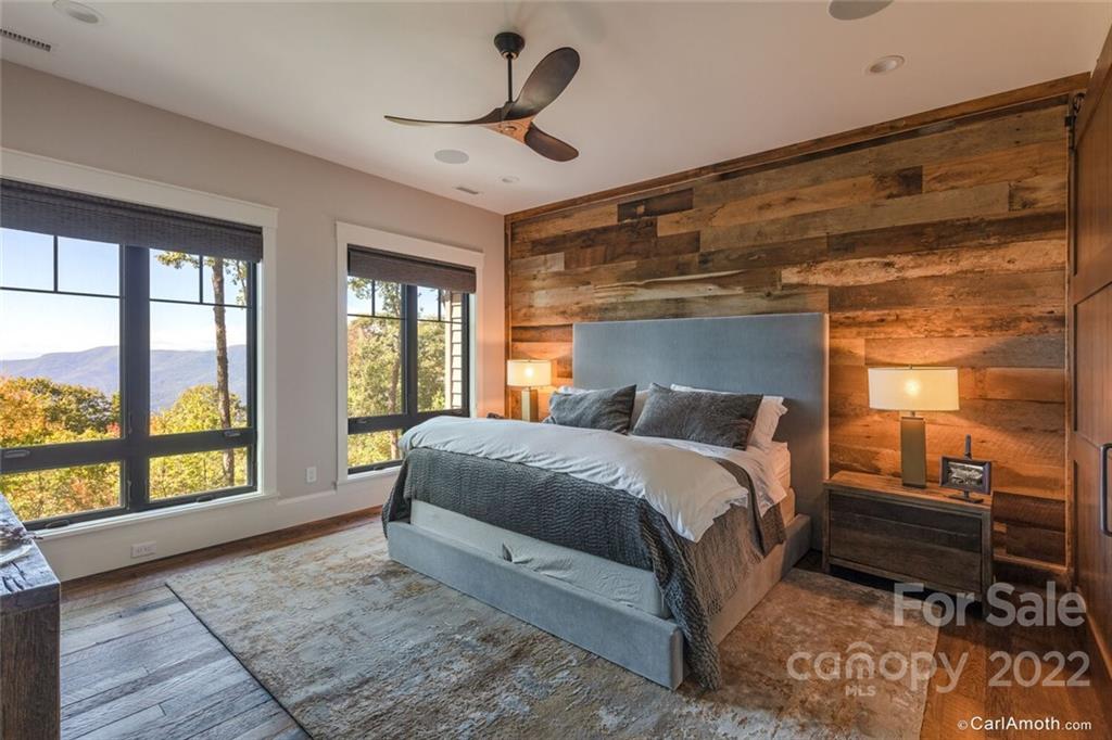 61 Back Bone Way, Unit 203 Sylva, NC 28779 - Photo 22 of 48 a bedroom with a large bed and a large window