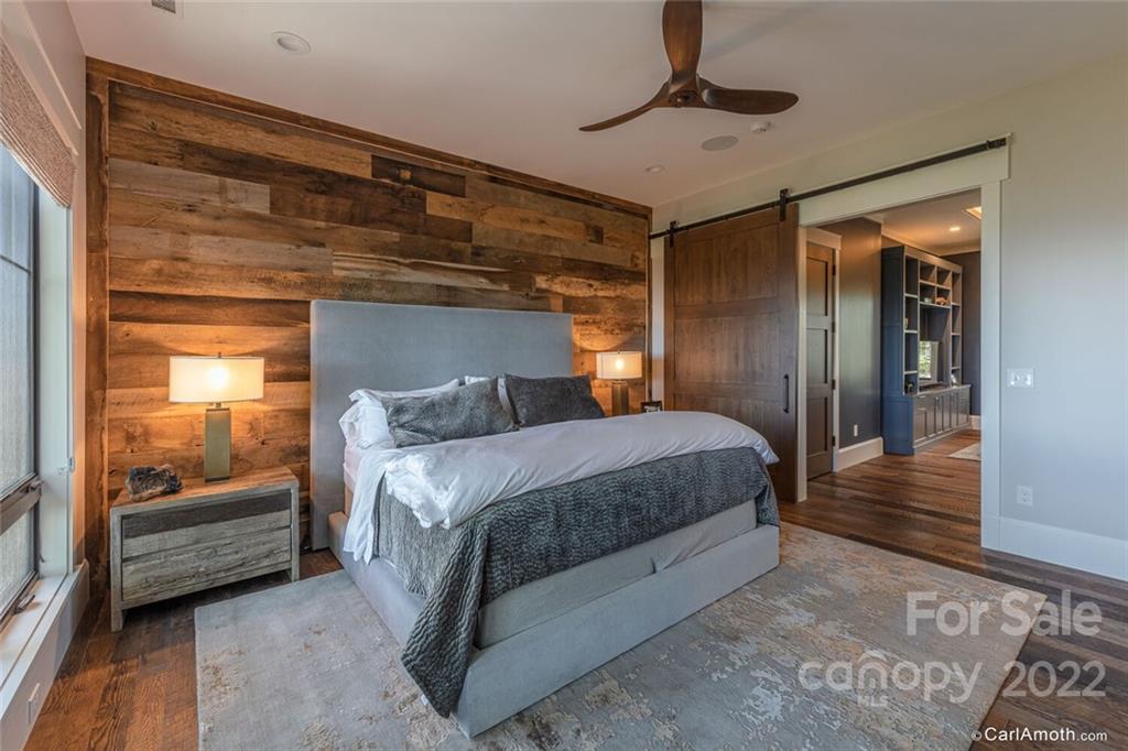 61 Back Bone Way, Unit 203 Sylva, NC 28779 - Photo 23 of 48 a bedroom with a bed and a window