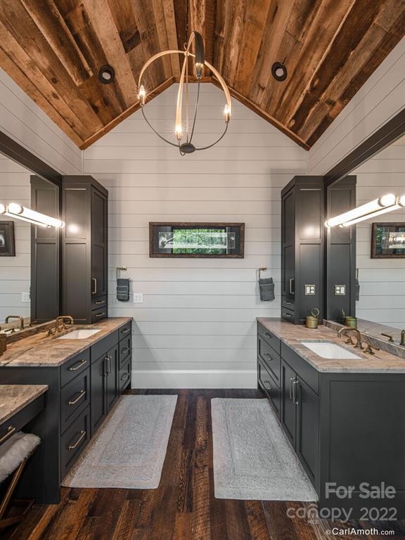 61 Back Bone Way, Unit 203 Sylva, NC 28779 - Photo 25 of 48 a bathroom with a sink a vanity and mirror