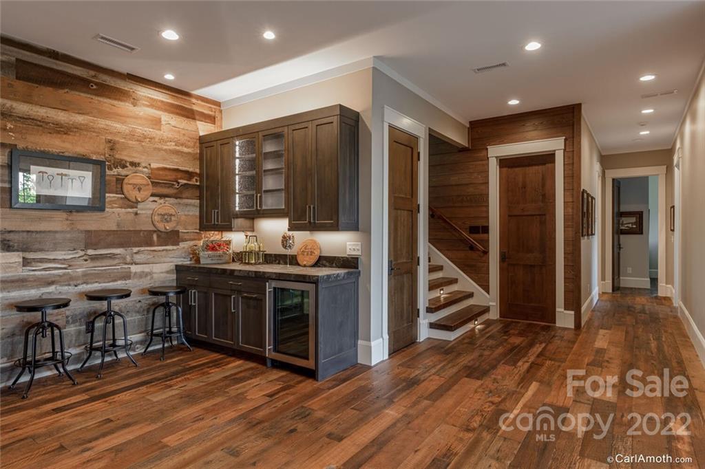 61 Back Bone Way, Unit 203 Sylva, NC 28779 - Photo 32 of 48 a kitchen with stainless steel appliances granite countertop a stove and a refrigerator