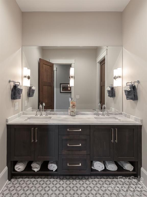 61 Back Bone Way, Unit 203 Sylva, NC 28779 - Photo 33 of 48 a bathroom with a sink and a mirror