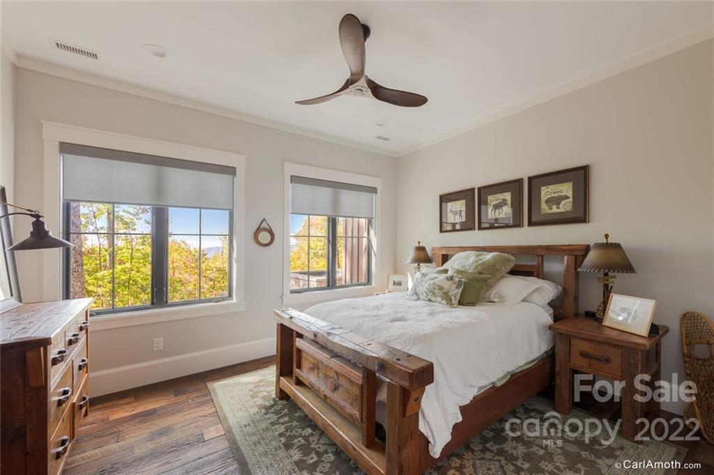 61 Back Bone Way, Unit 203 Sylva, NC 28779 - Photo 35 of 48 a bedroom with a large bed and a window
