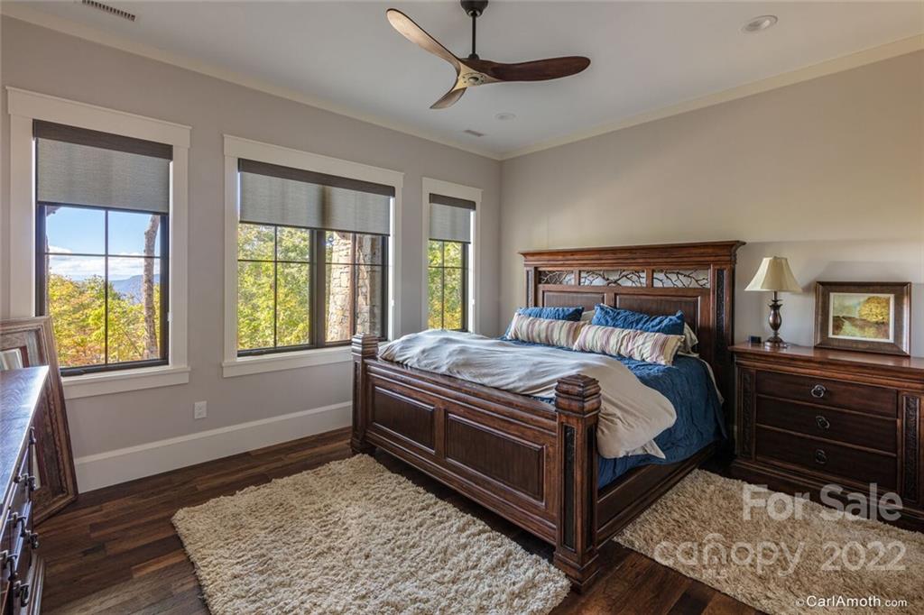 61 Back Bone Way, Unit 203 Sylva, NC 28779 - Photo 36 of 48 a bed sitting in a bedroom next to a window