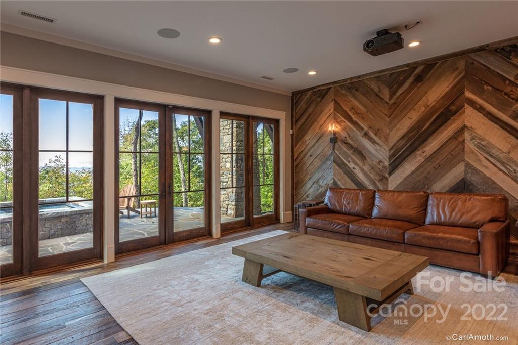 61 Back Bone Way, Unit 203 Sylva, NC 28779 - Photo 39 of 48 a living room with furniture and a floor to ceiling window