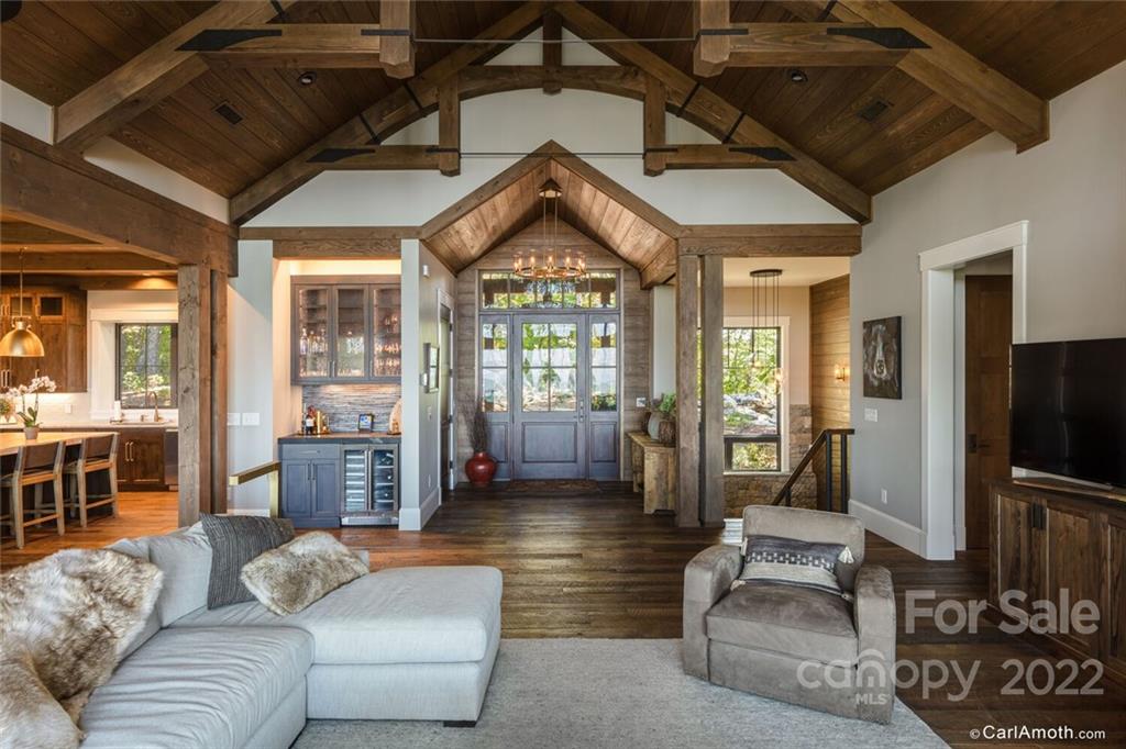 61 Back Bone Way, Unit 203 Sylva, NC 28779 - Photo 6 of 48 a living room with furniture and a flat screen tv