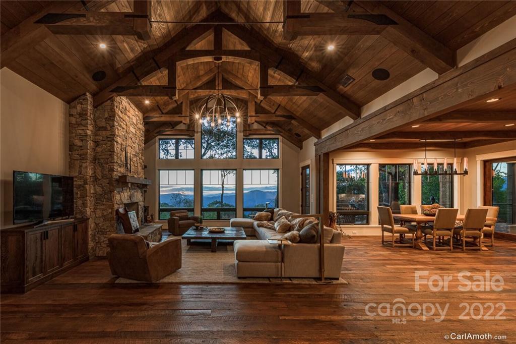 61 Back Bone Way, Unit 203 Sylva, NC 28779 - Photo 8 of 48 a living room with furniture and a flat screen tv