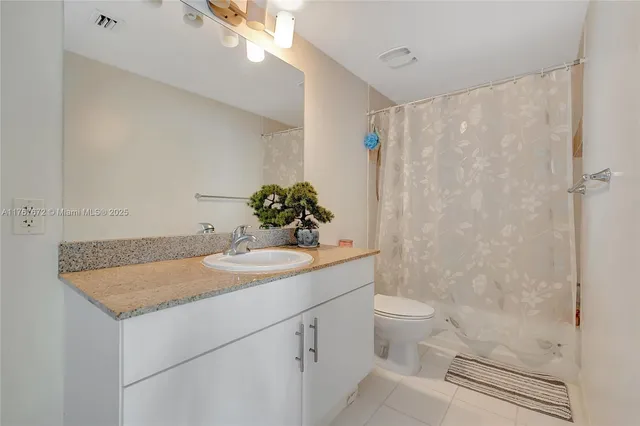 a bedroom with a bed and white walls