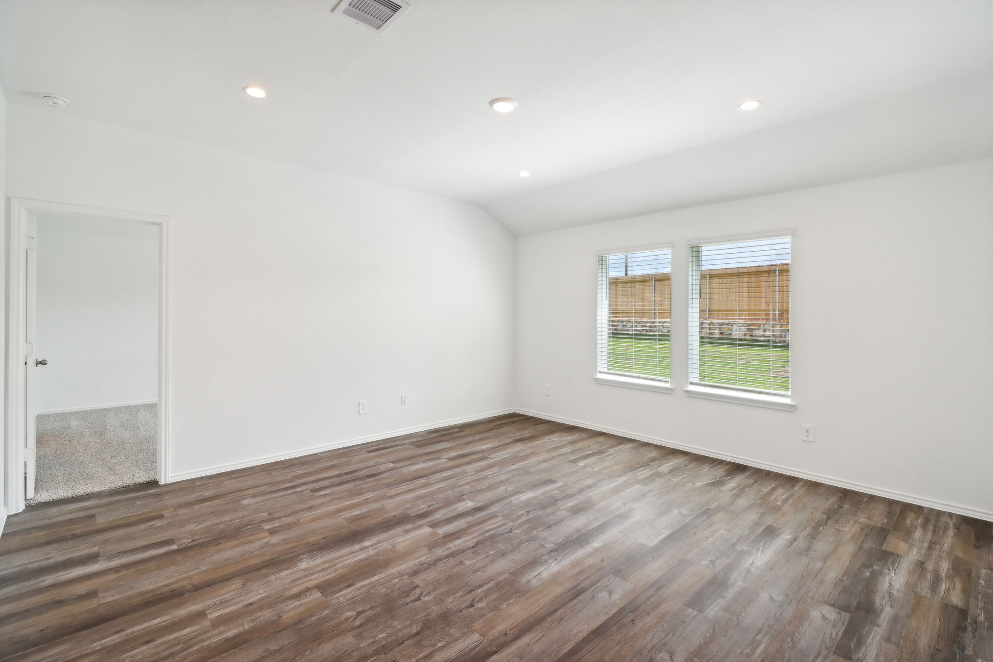 541 Wax Myrtle Way Hockley, TX 77447 - Photo 7 of 15 a view of an empty room with wooden floor and a window