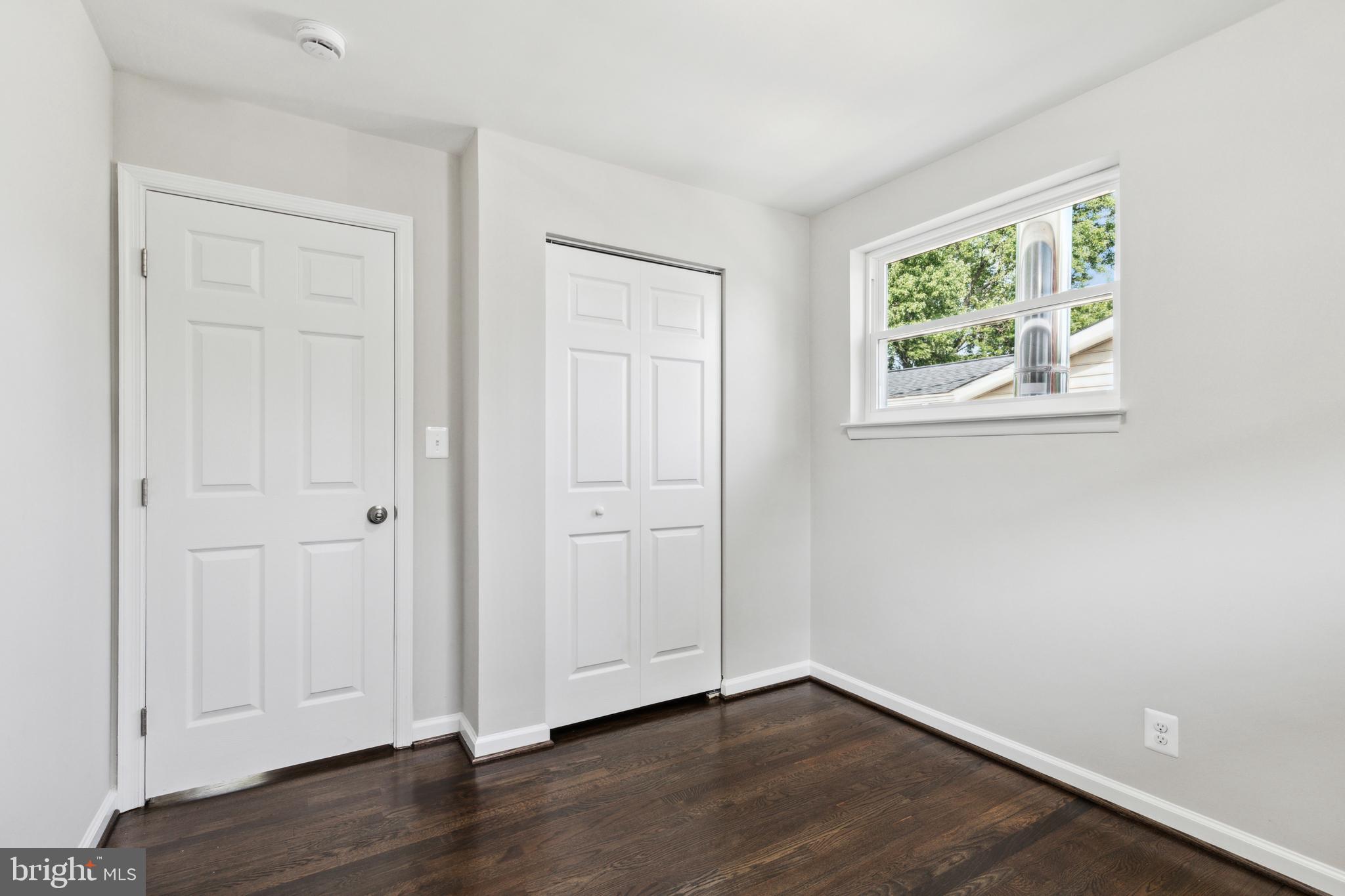 4436 Ebenezer Road Nottingham, MD 21236 - Photo 27 of 51 an empty room with wooden floor and windows