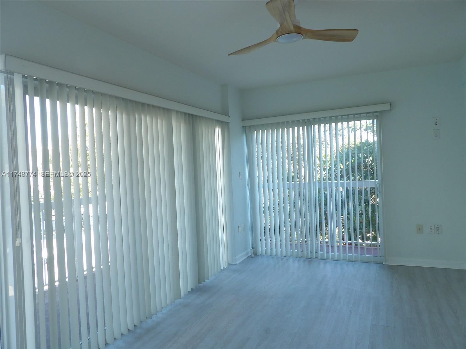 2740 Southwest 28th Terrace, Unit 301 Miami, FL 33133 - Photo 2 of 31 a view of an empty room with a window