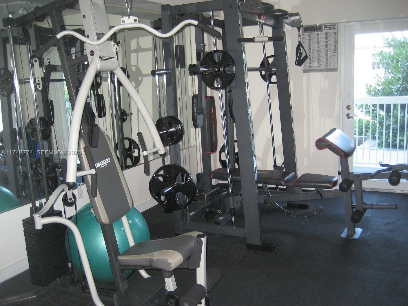 2740 Southwest 28th Terrace, Unit 301 Miami, FL 33133 - Photo 9 of 31 a view of a room with gym equipment