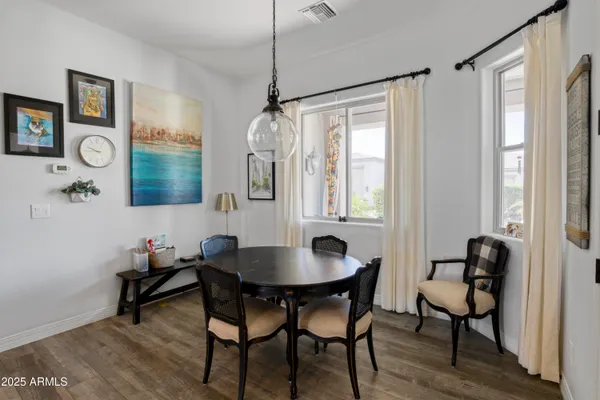a dining room with furniture and window