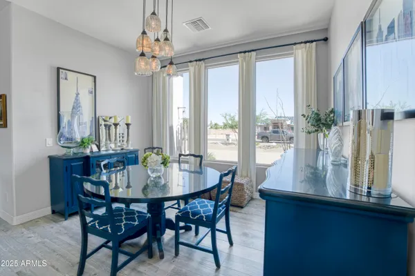 a view of a dining room with furniture window and outside view