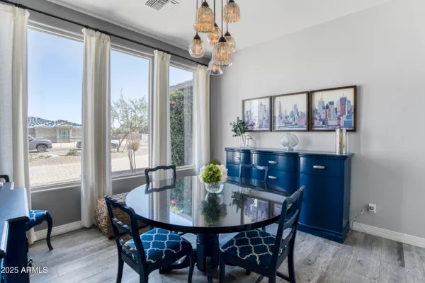 a view of a dining room with furniture window and wooden floor