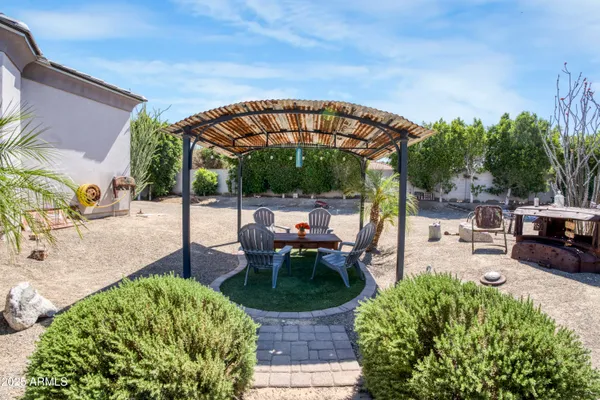 a view of a backyard with sitting area