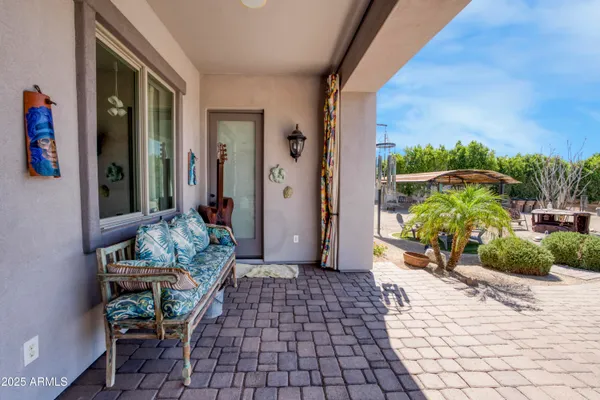 a view of a porch with furniture