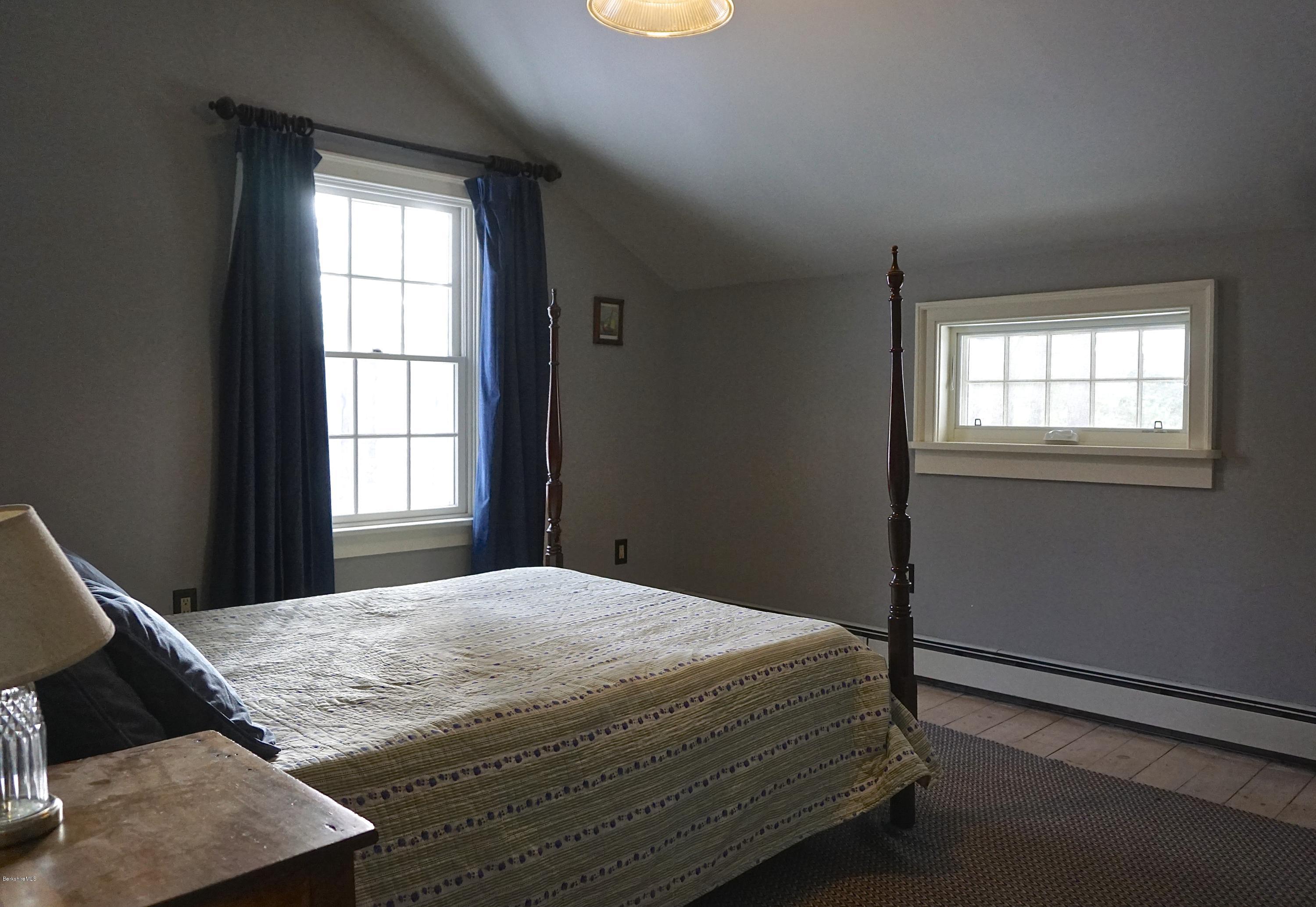 405 Main Road Monterey, MA 01245 - Photo 14 of 26 a bedroom with a bed and window