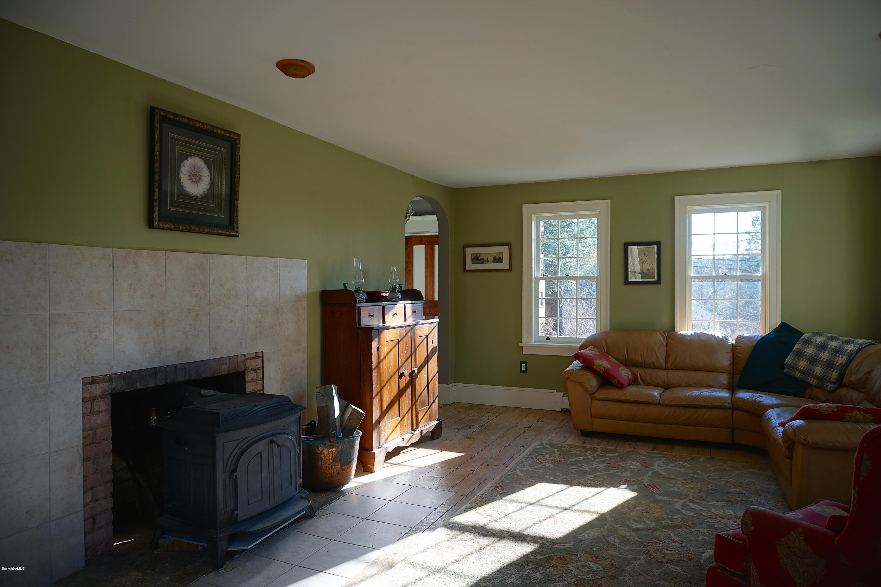 405 Main Road Monterey, MA 01245 - Photo 8 of 26 a living room with furniture window and a fireplace