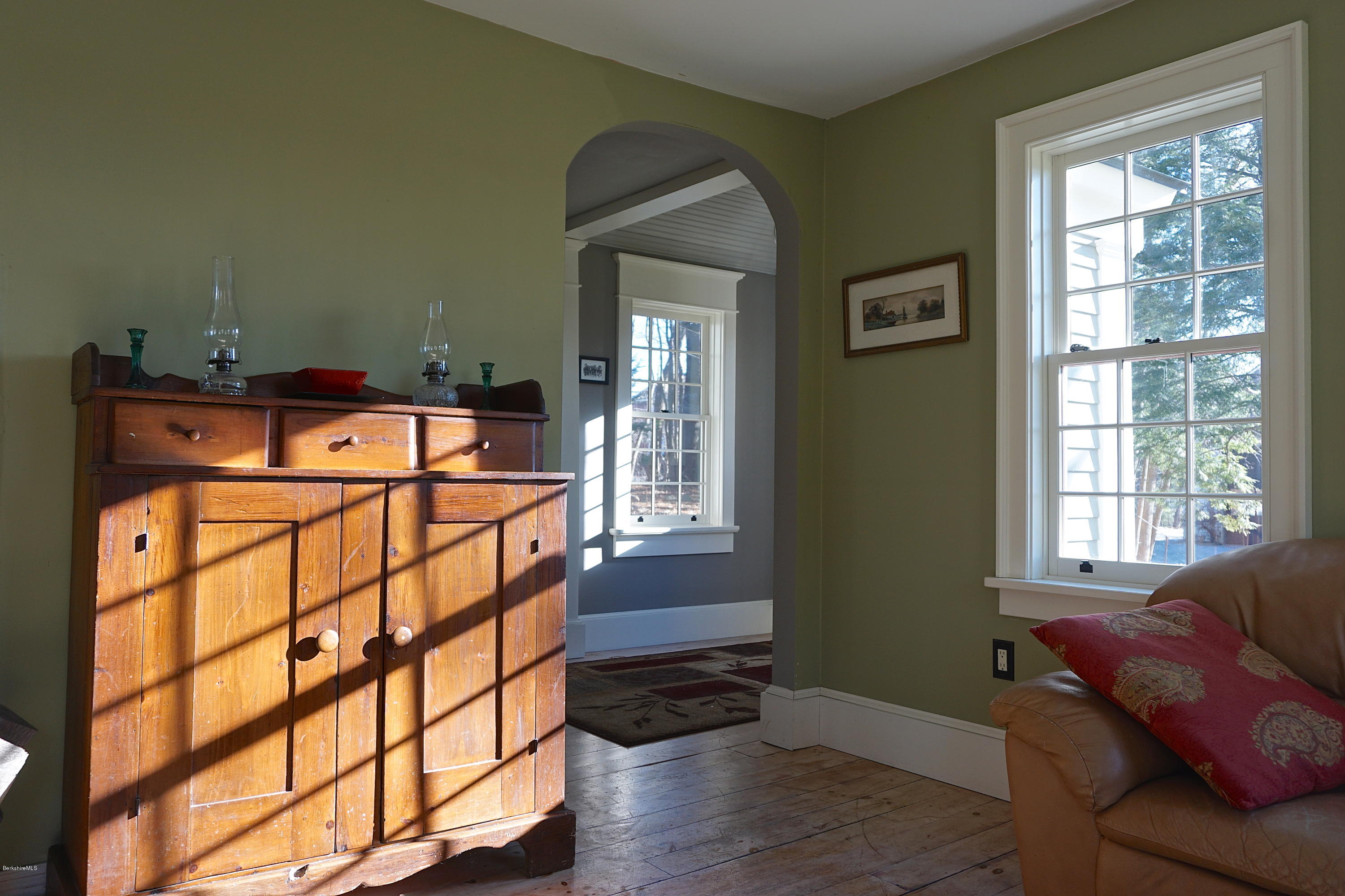 405 Main Road Monterey, MA 01245 - Photo 10 of 26 a bedroom with a bed and wooden floor
