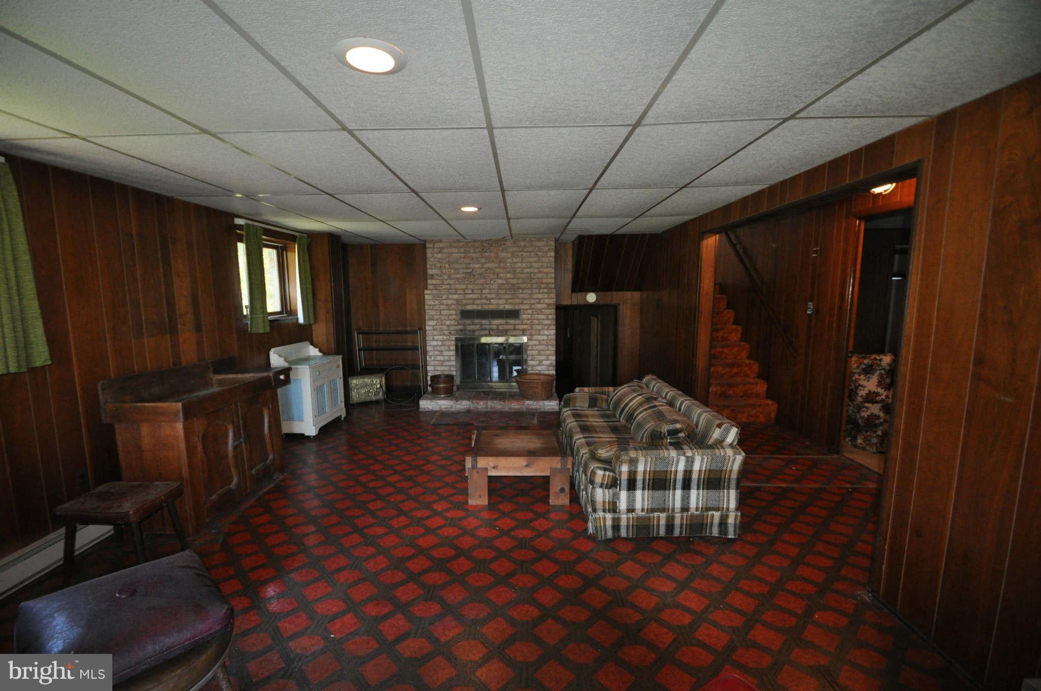 1454 Pleasant Valley Road Westminster, MD 21158 - Photo 22 of 27 SPACIOUS REC ROOM LOWER LEVEL W/FIREPLACE