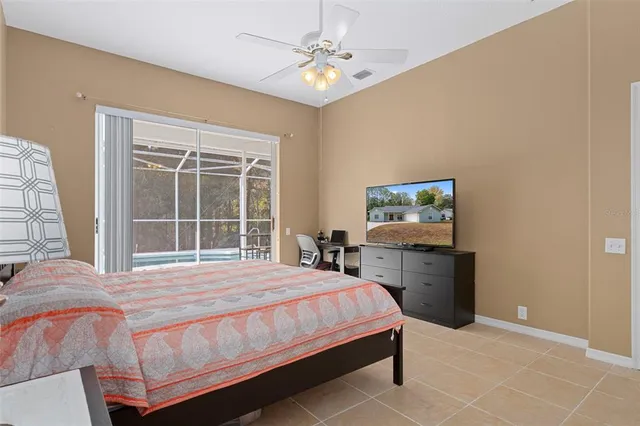 a bedroom with a bed and a table with chair